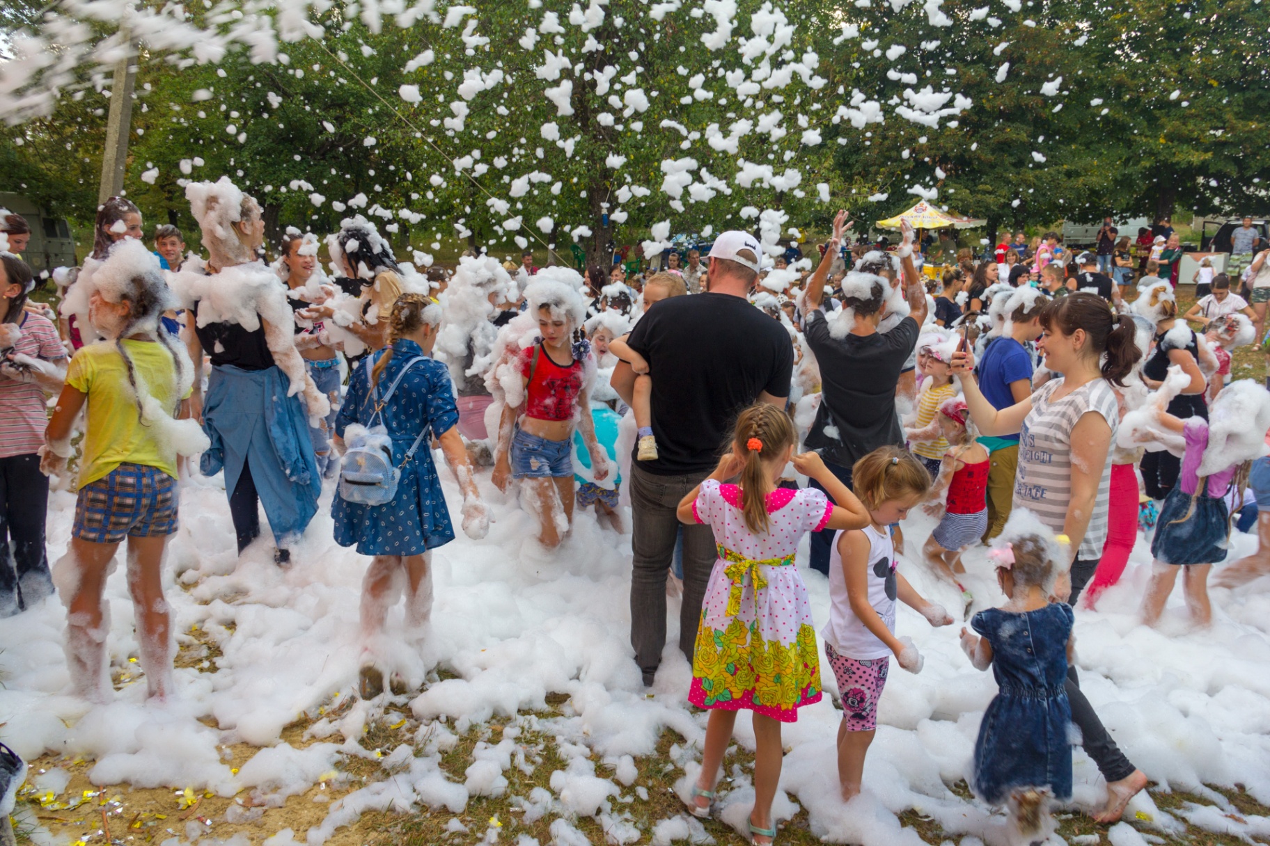 Kids enjoying foam party at community event